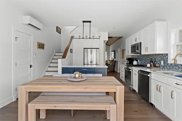 a view of kitchen with sink microwave and stove