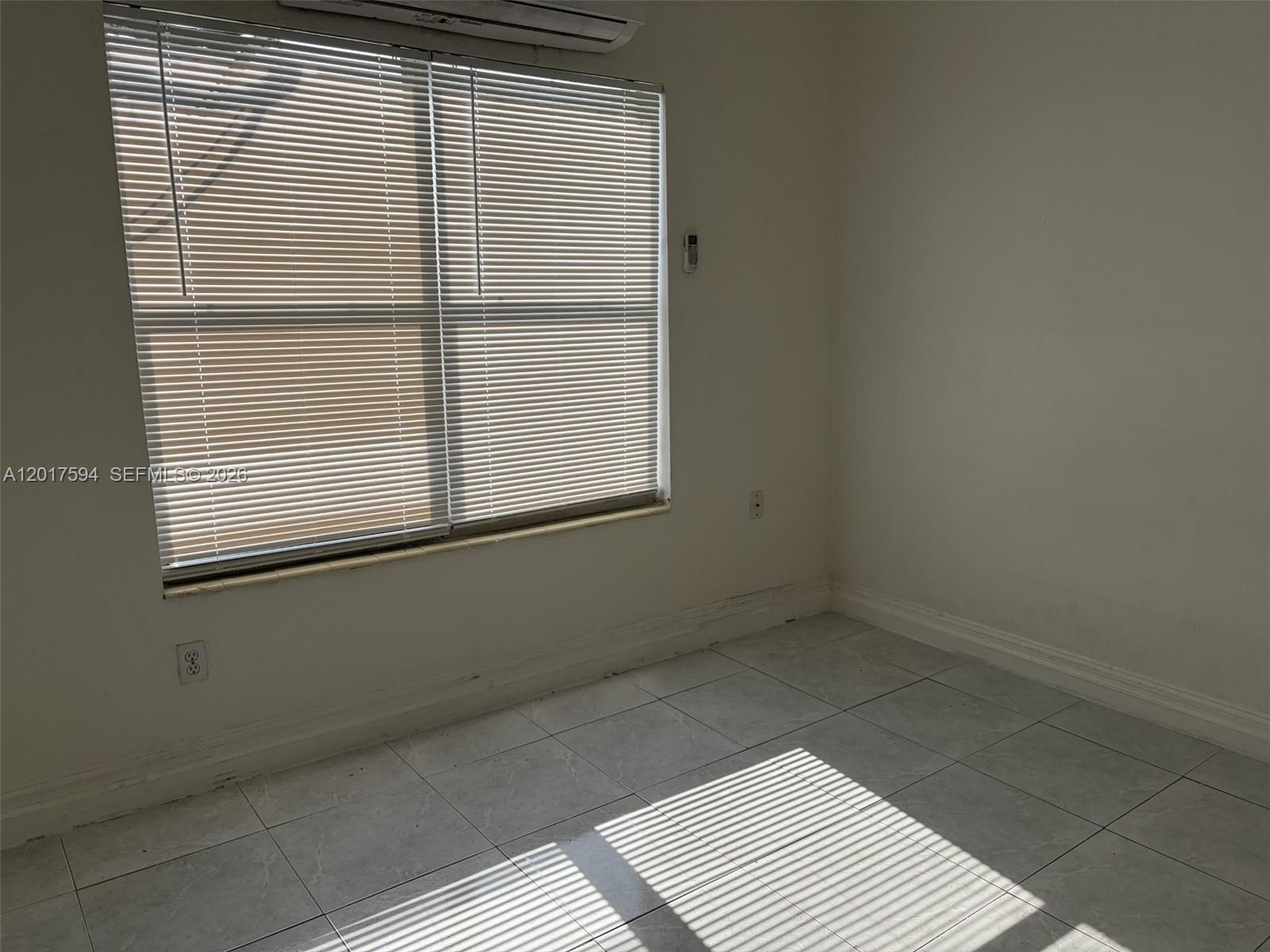4701 Southwest 8th Street, Unit 6 Miami, FL 33134 - Photo 3 of 4 a view of a room that has a window in it