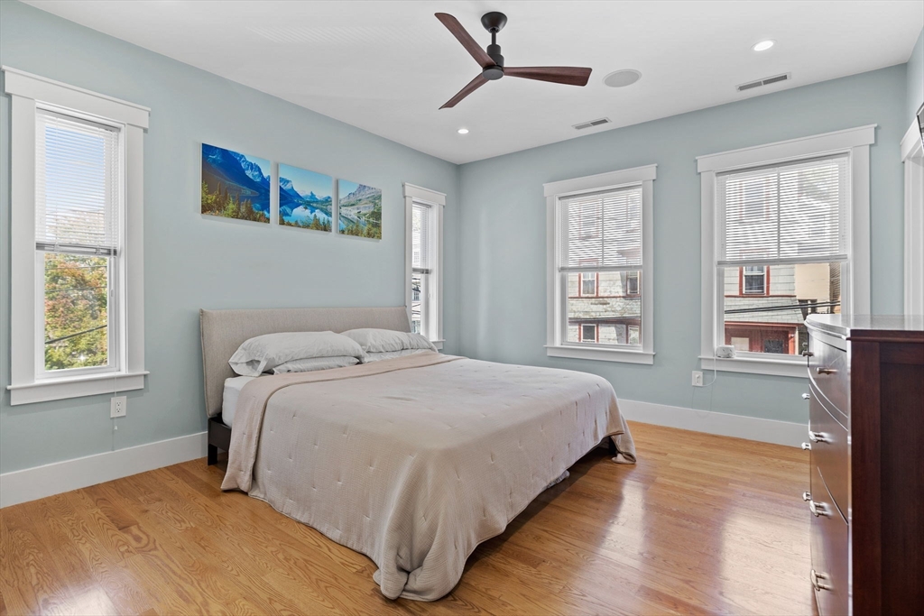 11 Ashland Street, Unit 2 Boston, MA 02122 - Photo 11 of 34 a bedroom with a large bed and a window