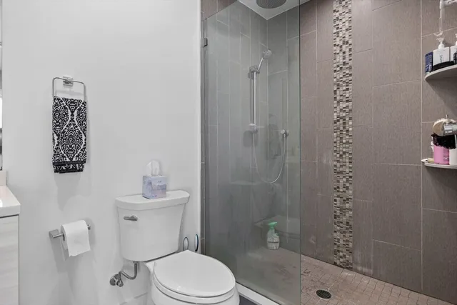 a bathroom with a bathtub and shower
