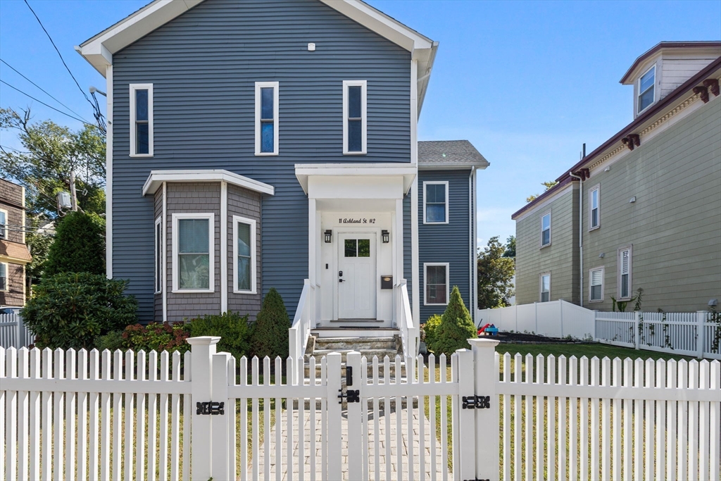 11 Ashland Street, Unit 2 Boston, MA 02122 - Photo 29 of 34 a front view of a house with a fence