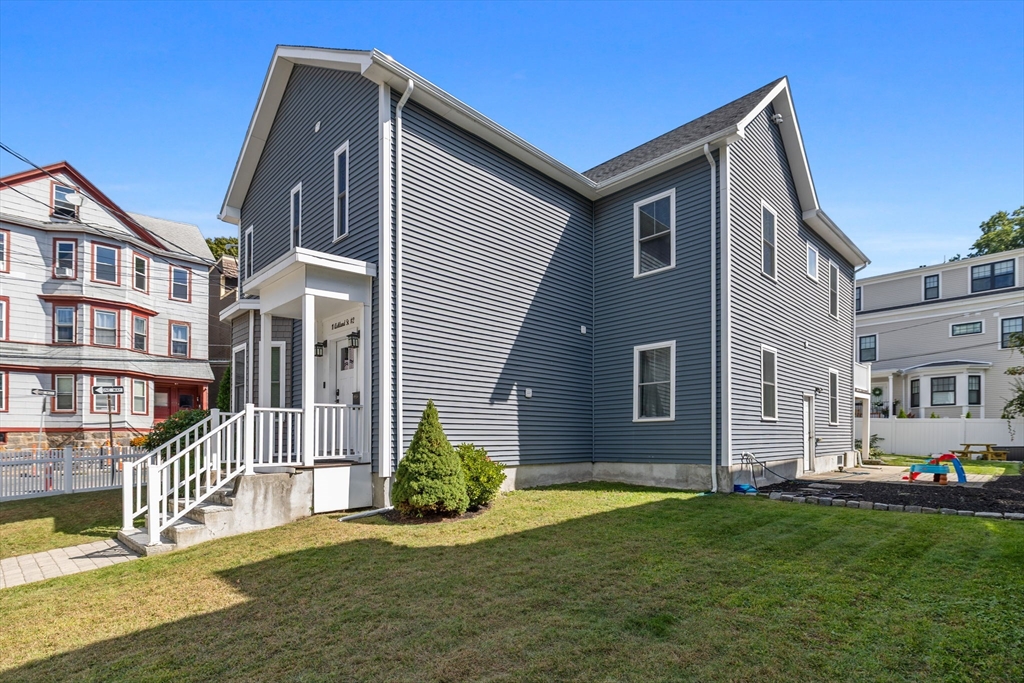 11 Ashland Street, Unit 2 Boston, MA 02122 - Photo 32 of 34 a front view of a house with a yard