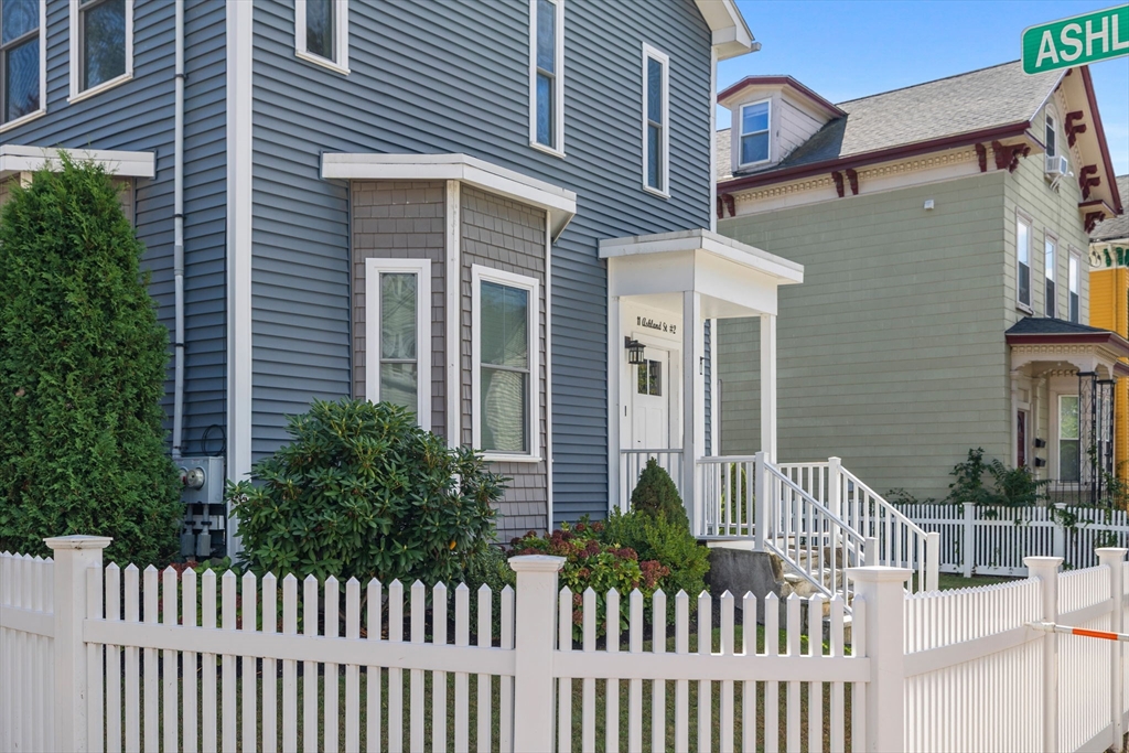 11 Ashland Street, Unit 2 Boston, MA 02122 - Photo 34 of 34 a front view of a house with a fence