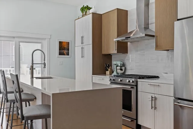 a kitchen with granite countertop a stove and a sink
