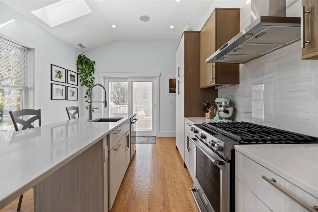 11 Ashland Street, Unit 2 Boston, MA 02122 - Photo 5 of 34 a kitchen with granite countertop a stove and a sink