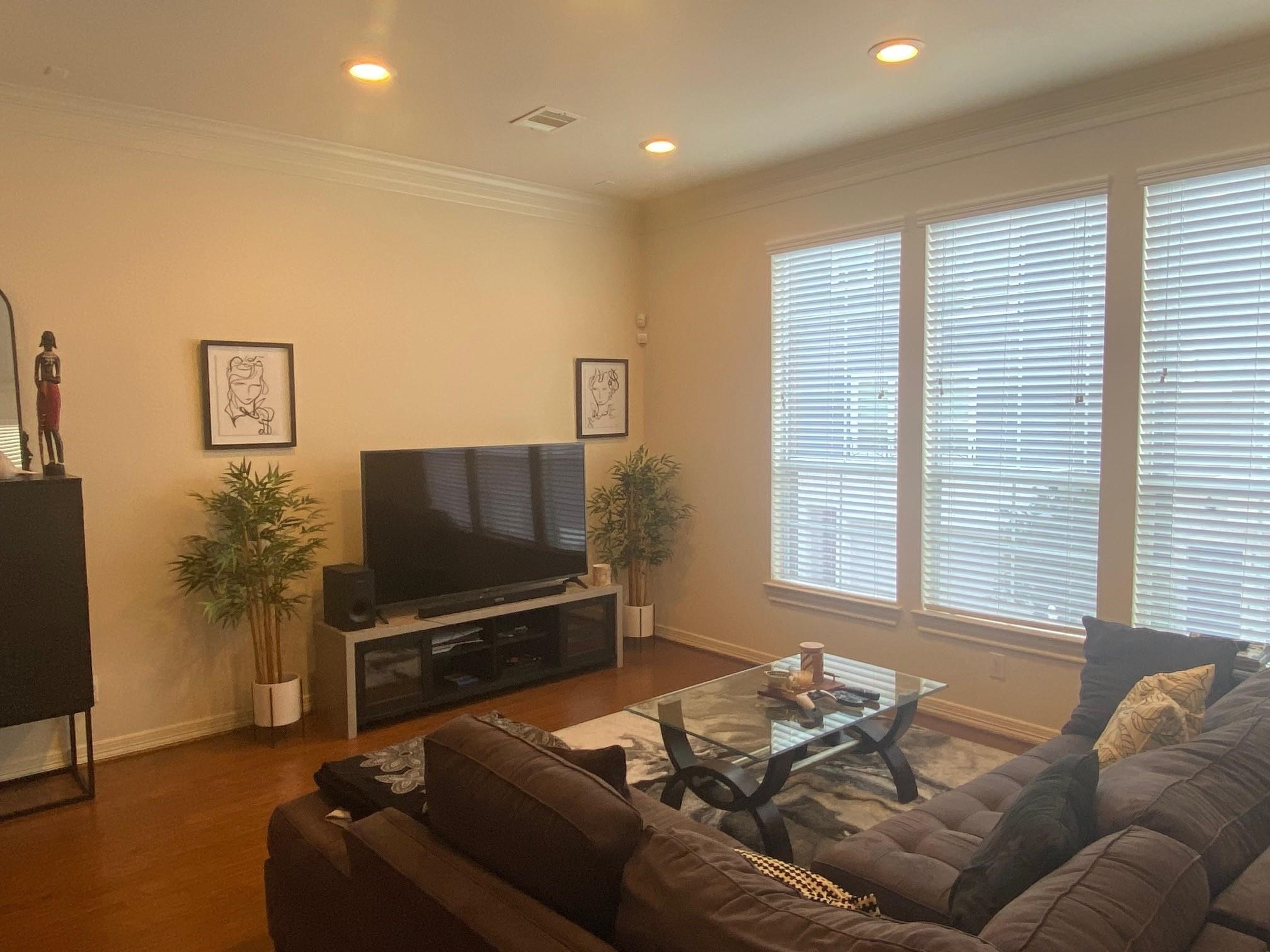 3209 Clearview Circle Houston, TX 77025 - Photo 3 of 13 a living room with furniture and a flat screen tv