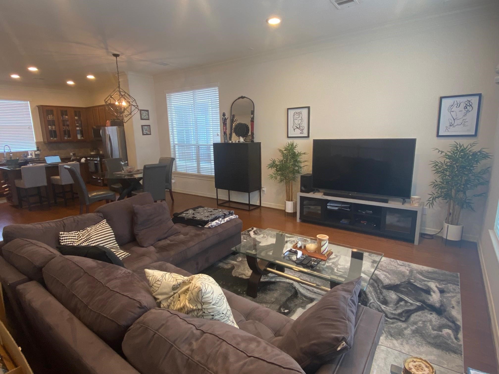 3209 Clearview Circle Houston, TX 77025 - Photo 4 of 13 a living room with furniture and a flat screen tv