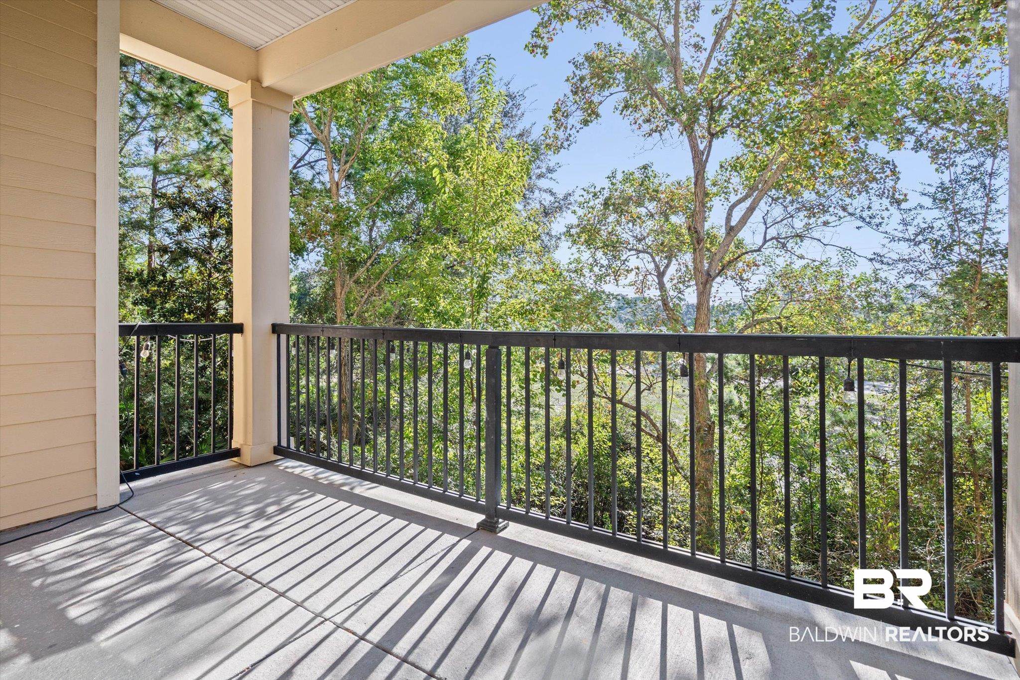 1430 Regency Road, Unit C202 Gulf Shores, AL 36542 - Photo 20 of 27 Balcony overlooking woods