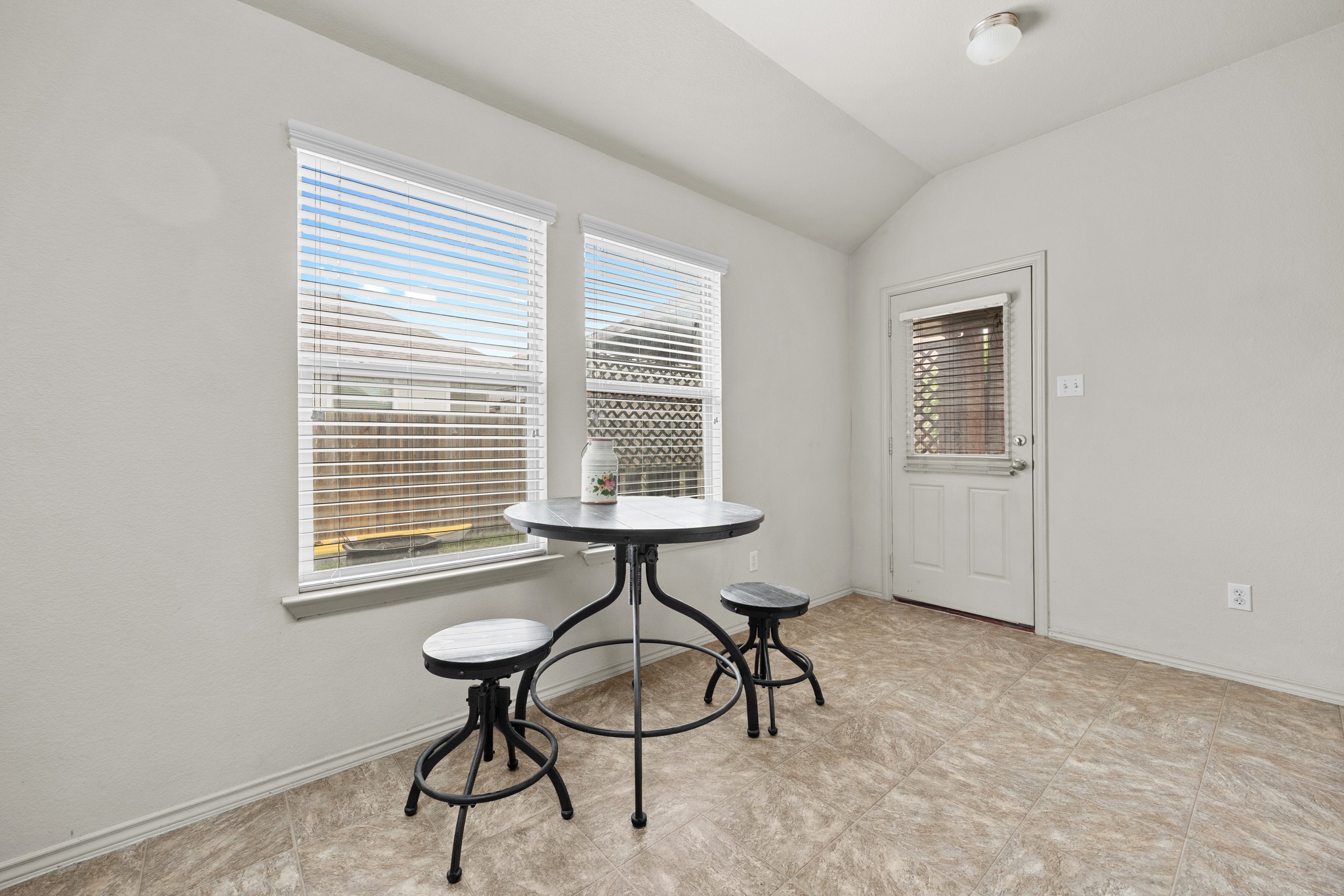 621 Amber Lane Jarrell, TX 76537 - Photo 11 of 22 a view of a room that has a window and a table in it