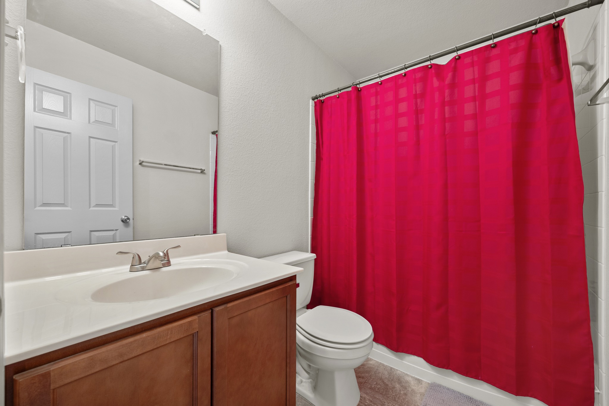 621 Amber Lane Jarrell, TX 76537 - Photo 18 of 22 a bathroom with a sink a toilet and shower