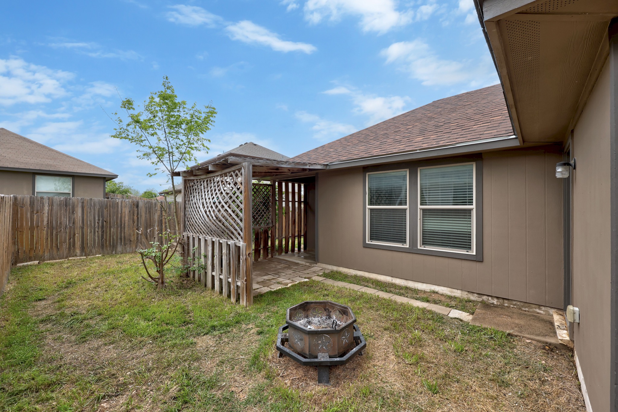 621 Amber Lane Jarrell, TX 76537 - Photo 21 of 22 a front view of a house with garden