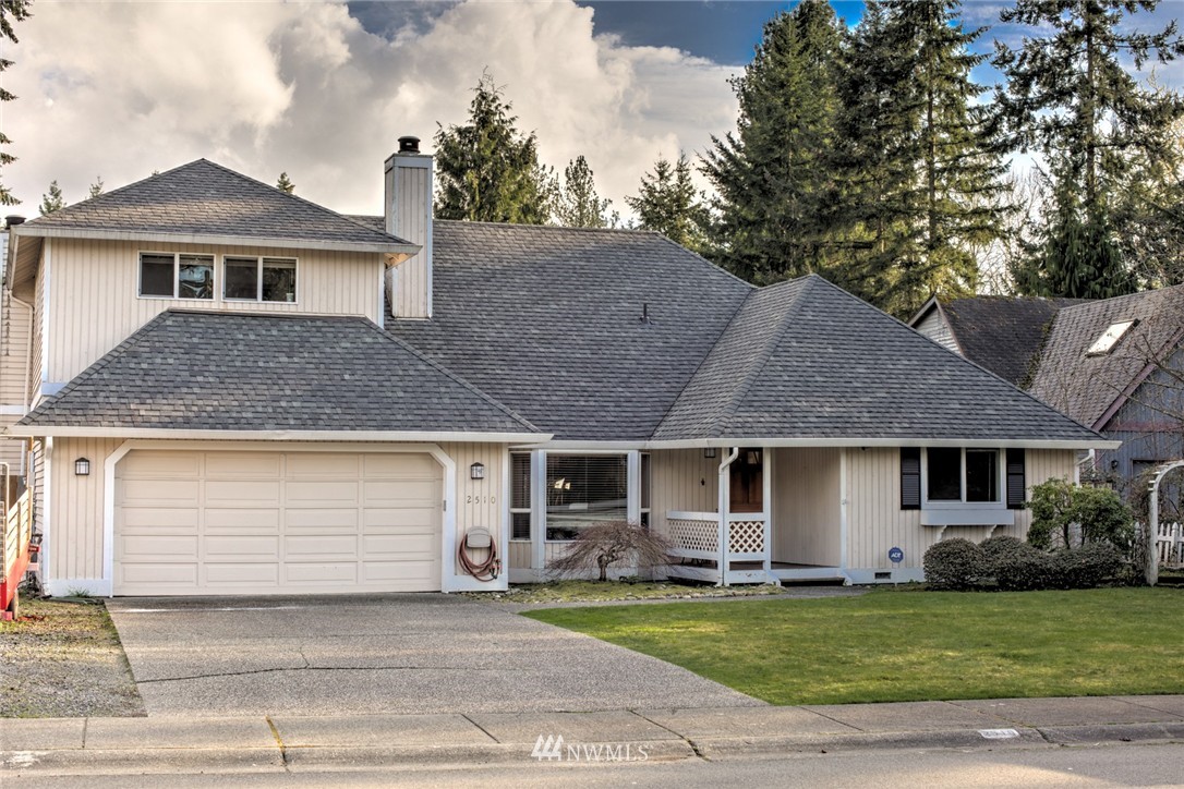 2510 166th Place Southeast Bothell, WA 98012 - Photo 1 of 24 a front view of a house with a garden