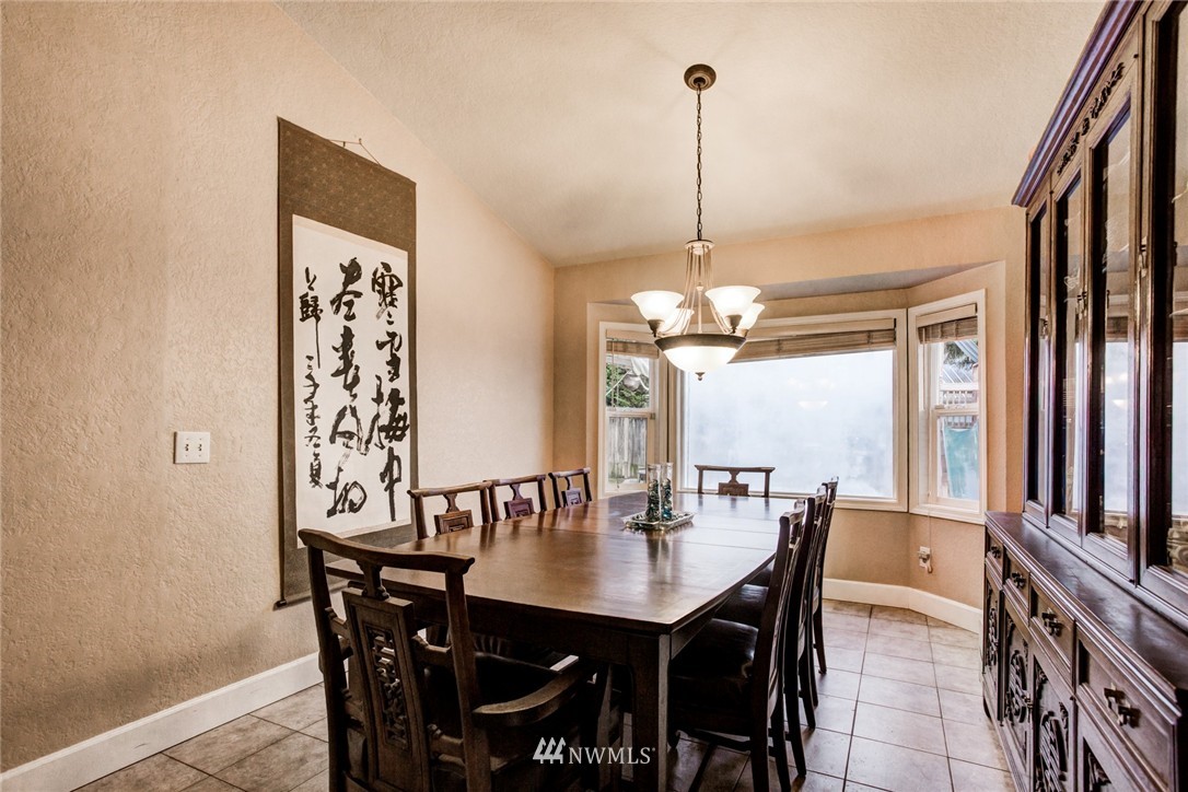 2510 166th Place Southeast Bothell, WA 98012 - Photo 8 of 24 a view of a dining room with furniture window and wooden floor