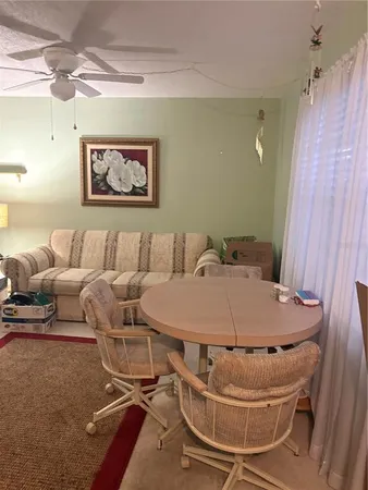 a kitchen with a sink cabinets and wooden floor