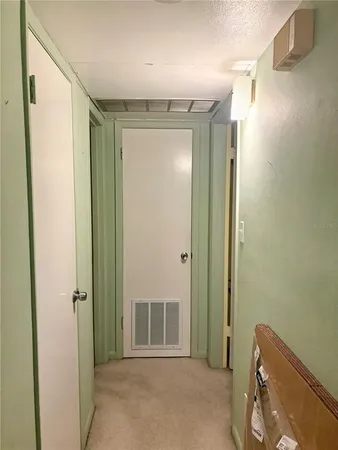 a bathroom with a tub and a fan