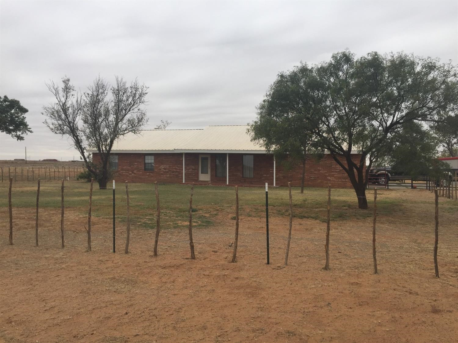 1712 Lovebird Road Lubbock, TX 79407 - Photo 2 of 5 a view of a house with a backyard