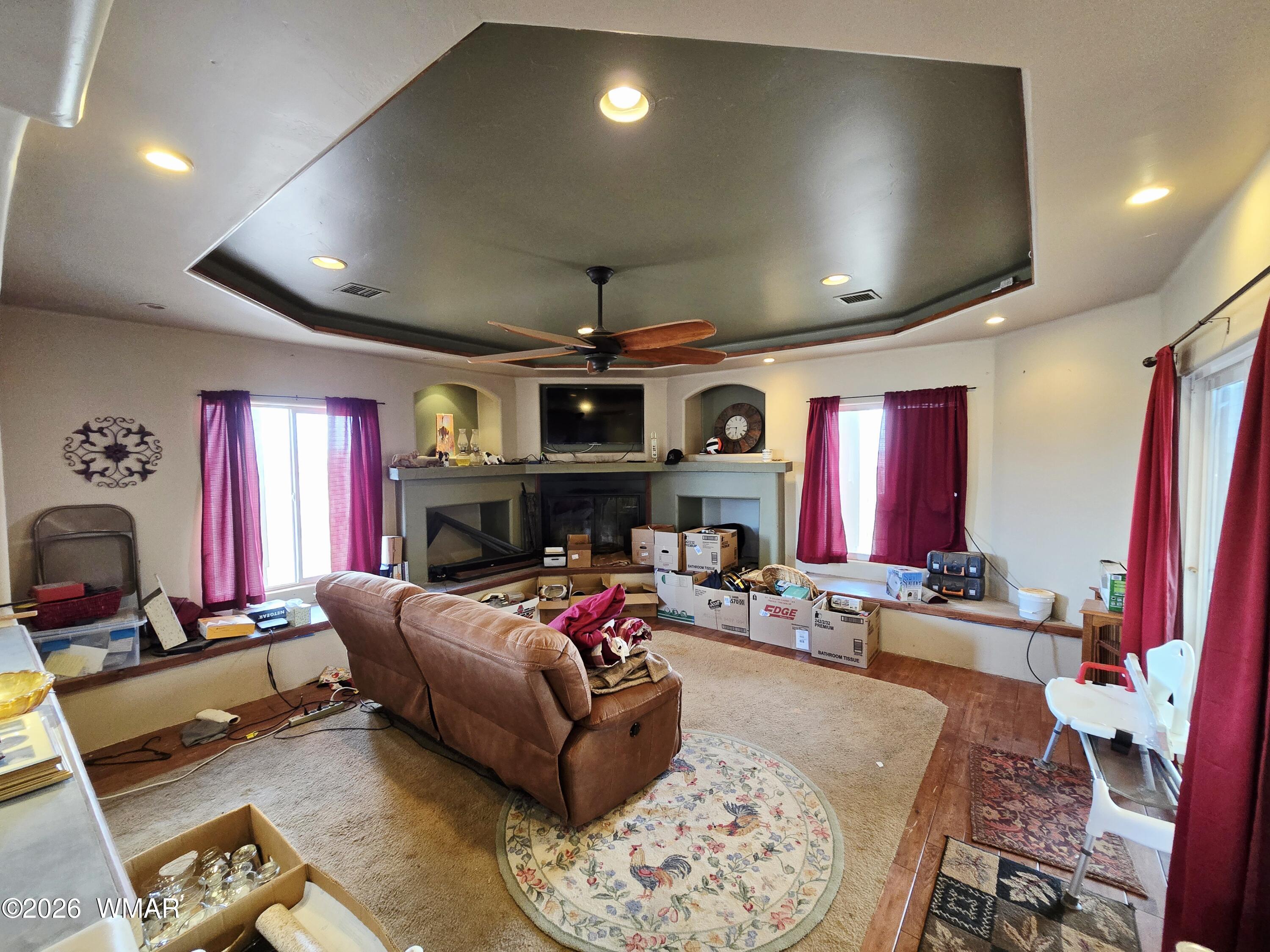 9046 Miller Trail Snowflake, AZ 85937 - Photo 9 of 34 a living room with furniture a flat screen tv and a fireplace