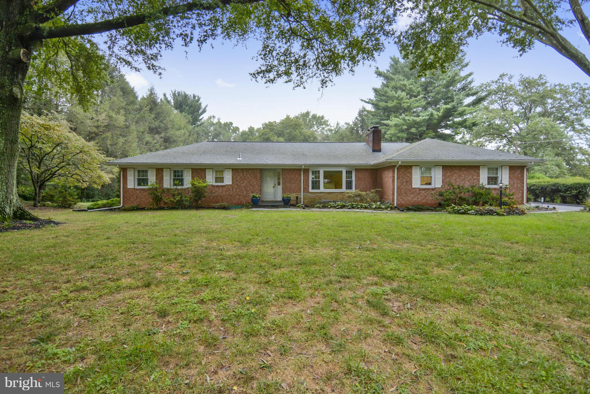 2138 Apple Tree Lane Silver Spring, MD 20905 - Photo 2 of 30 a front view of a house with a garden