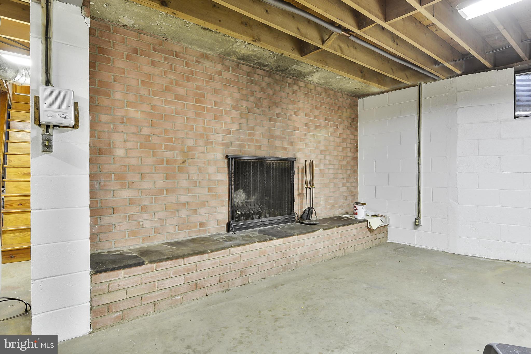 2138 Apple Tree Lane Silver Spring, MD 20905 - Photo 16 of 30 a view of an empty room with a fireplace and a window