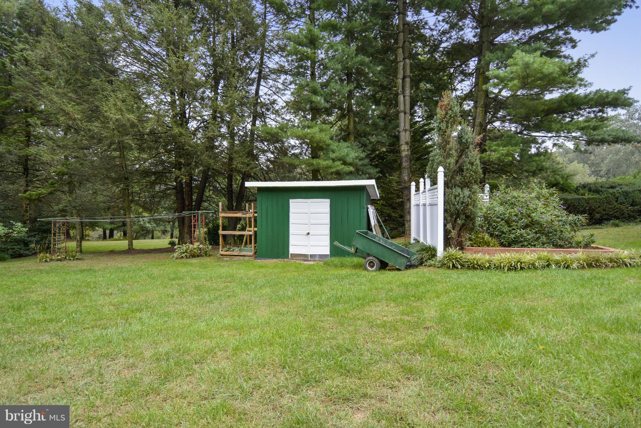 2138 Apple Tree Lane Silver Spring, MD 20905 - Photo 23 of 30 a view of a house with a yard and a large tree