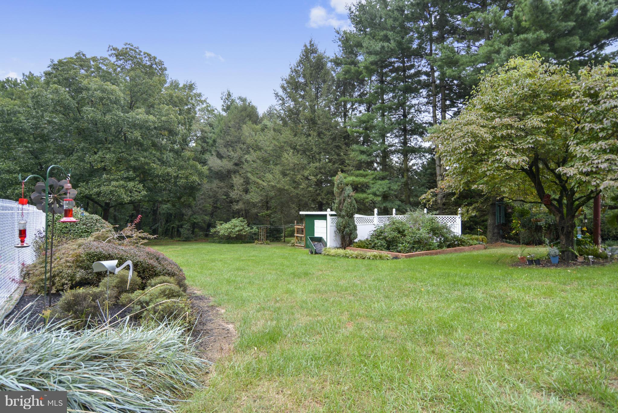 2138 Apple Tree Lane Silver Spring, MD 20905 - Photo 26 of 30 a view of a garden with a house in the background
