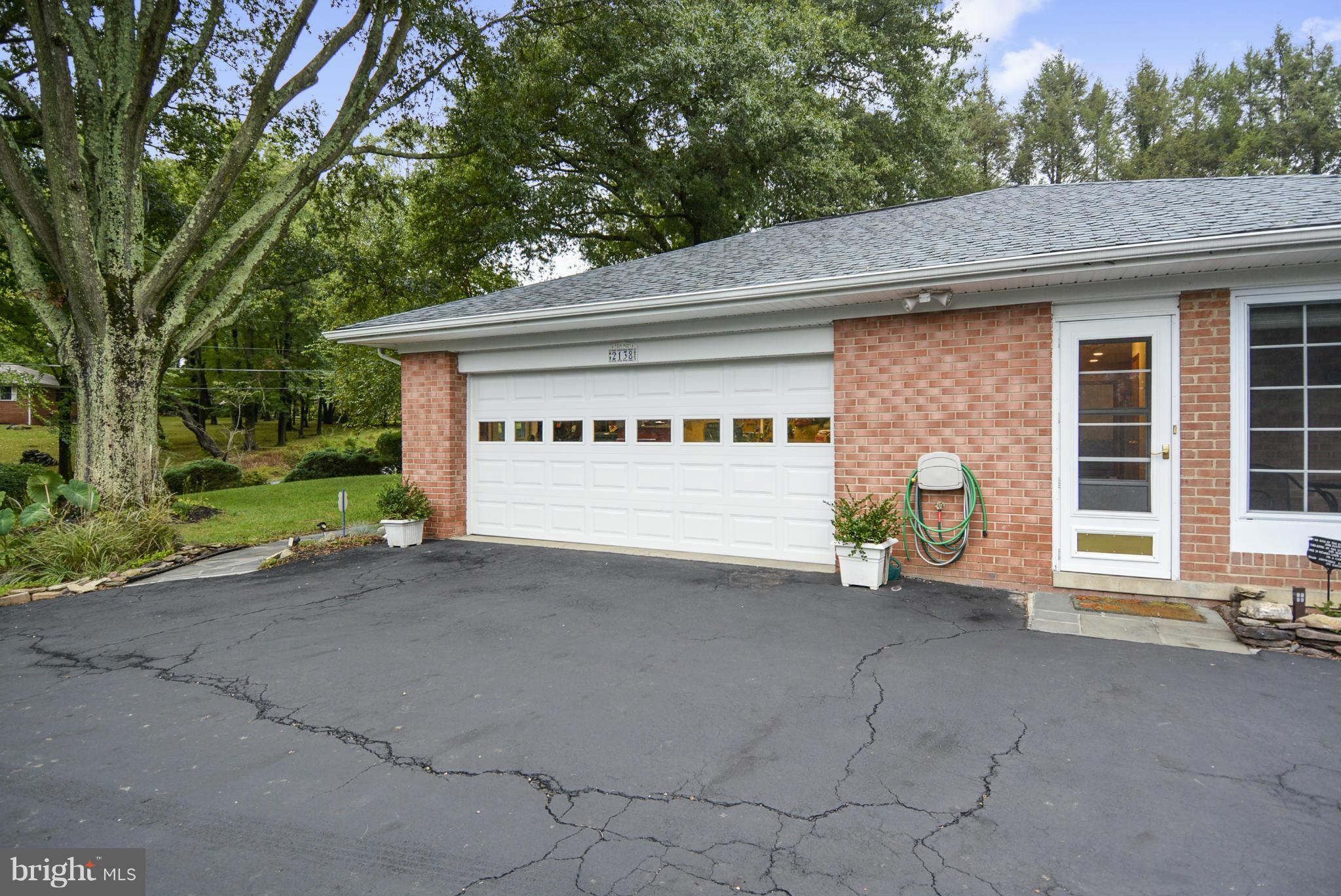 2138 Apple Tree Lane Silver Spring, MD 20905 - Photo 29 of 30 a view of a house with a yard and garage