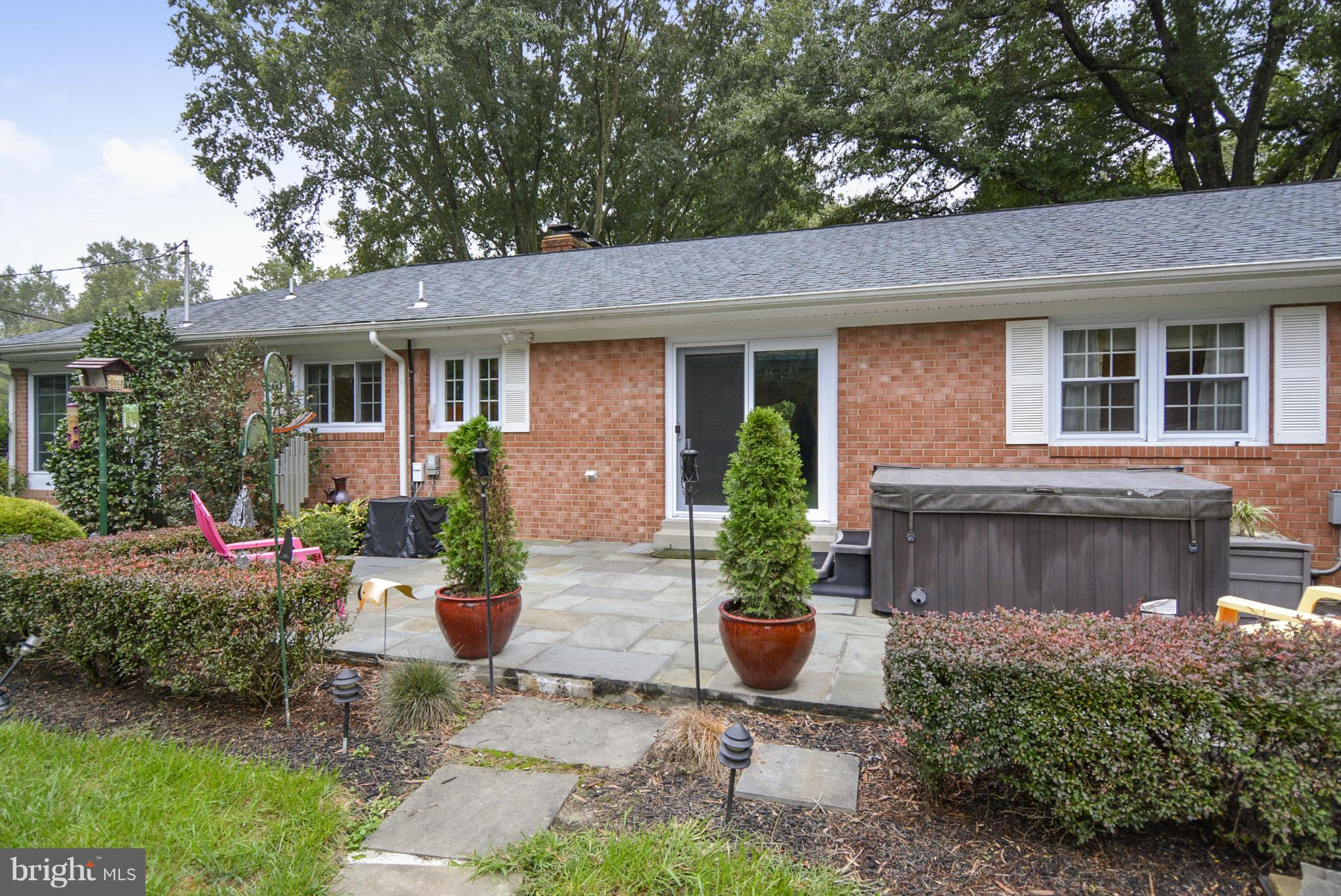 2138 Apple Tree Lane Silver Spring, MD 20905 - Photo 30 of 30 a front view of a house with plants and garden