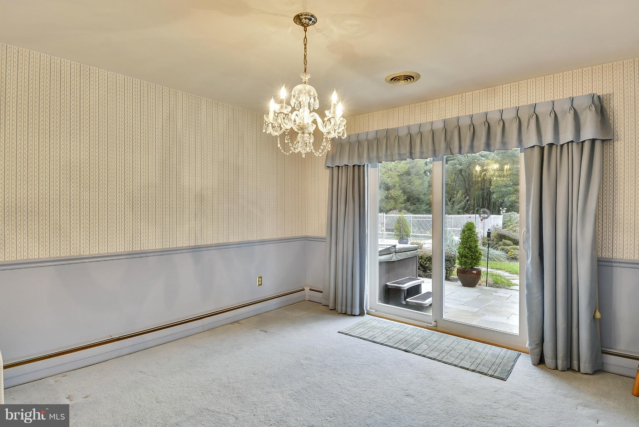 2138 Apple Tree Lane Silver Spring, MD 20905 - Photo 6 of 30 a view of a room with window view and a chandelier