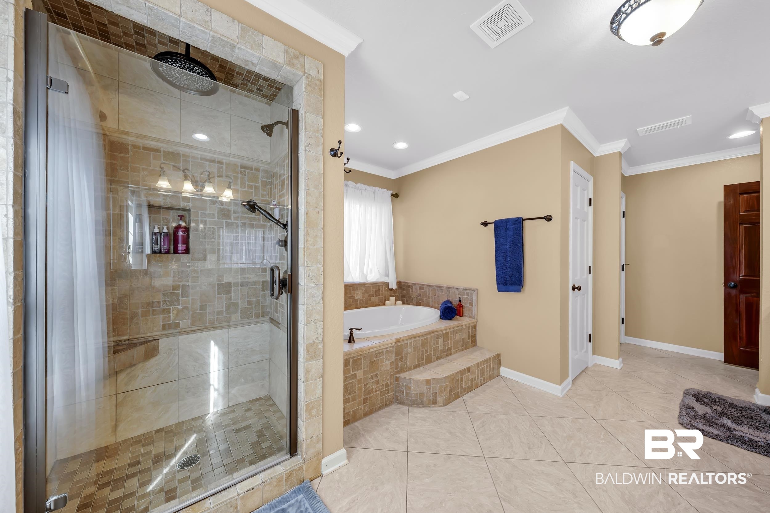 22929 Highway 98 Foley, AL 36535 - Photo 19 of 54 Bathroom with a bath, a stall shower, crown molding, tile patterned floors, and recessed lighting