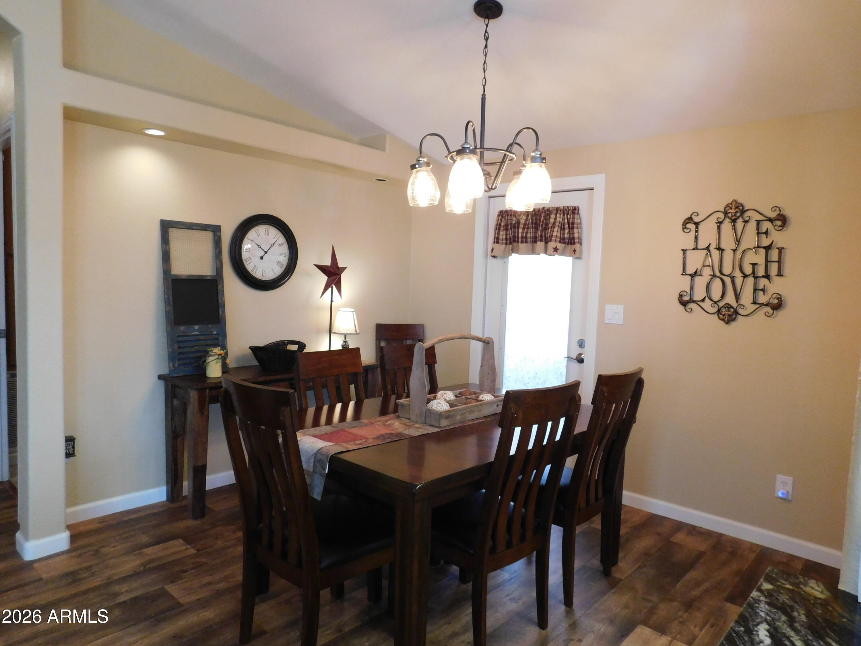 3301 South Goldfield Road, Unit 1054 Apache Junction, AZ 85119 - Photo 16 of 41 a view of a dining room with a table and chairs