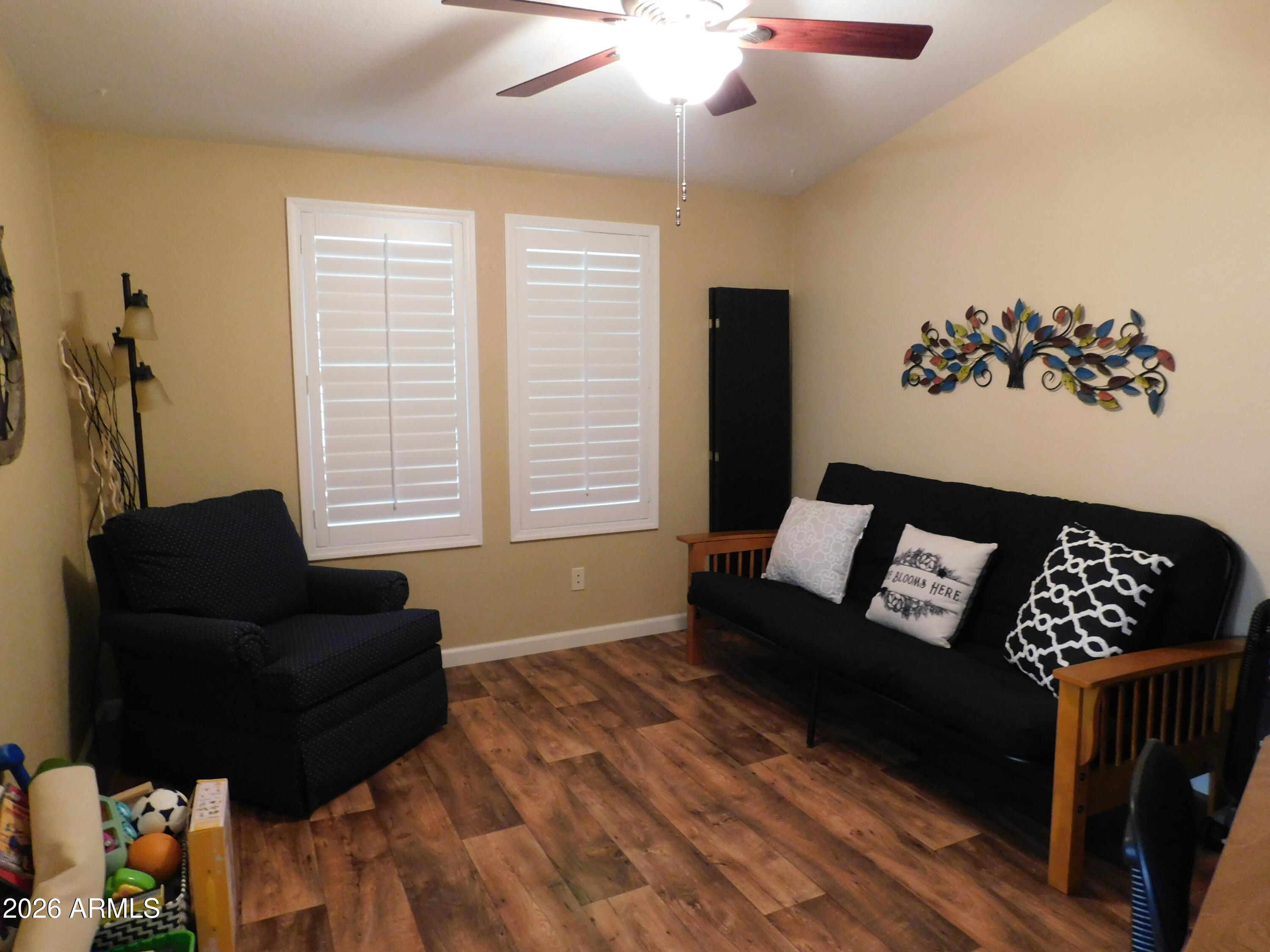 3301 South Goldfield Road, Unit 1054 Apache Junction, AZ 85119 - Photo 18 of 41 a living room with furniture and a window
