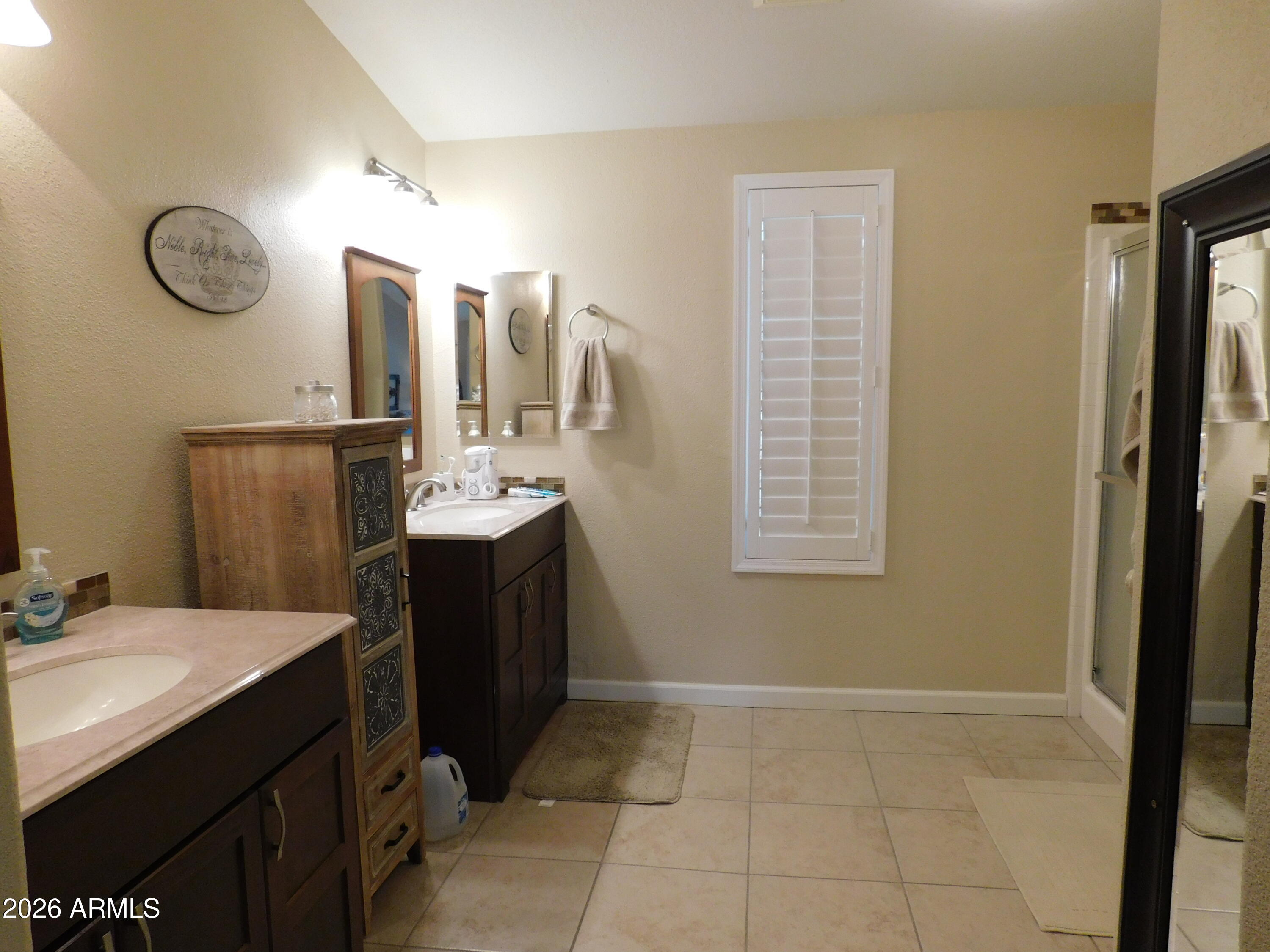 3301 South Goldfield Road, Unit 1054 Apache Junction, AZ 85119 - Photo 28 of 41 a bathroom with a sink vanity and a mirror