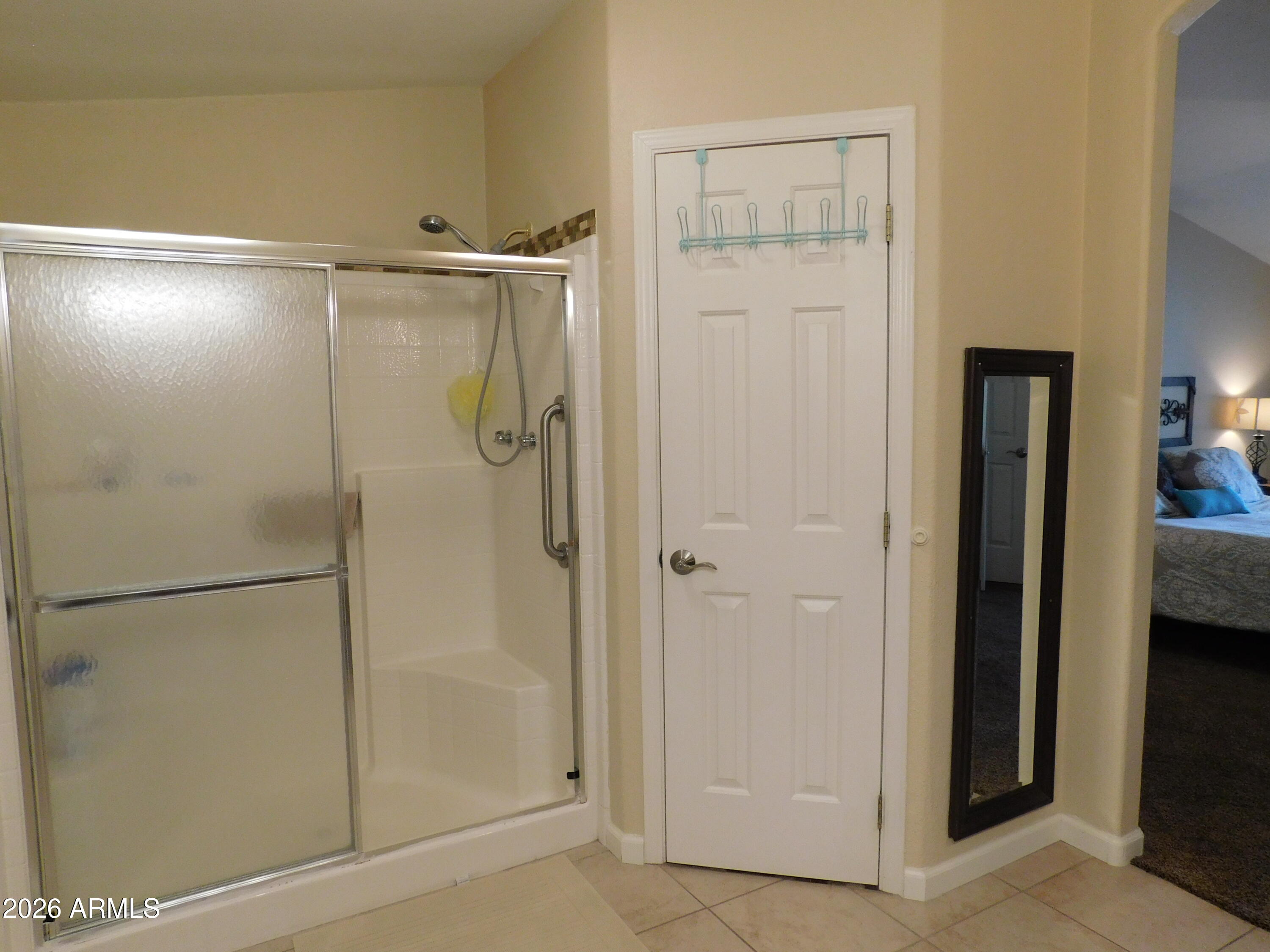 3301 South Goldfield Road, Unit 1054 Apache Junction, AZ 85119 - Photo 29 of 41 a bathroom with a glass shower door