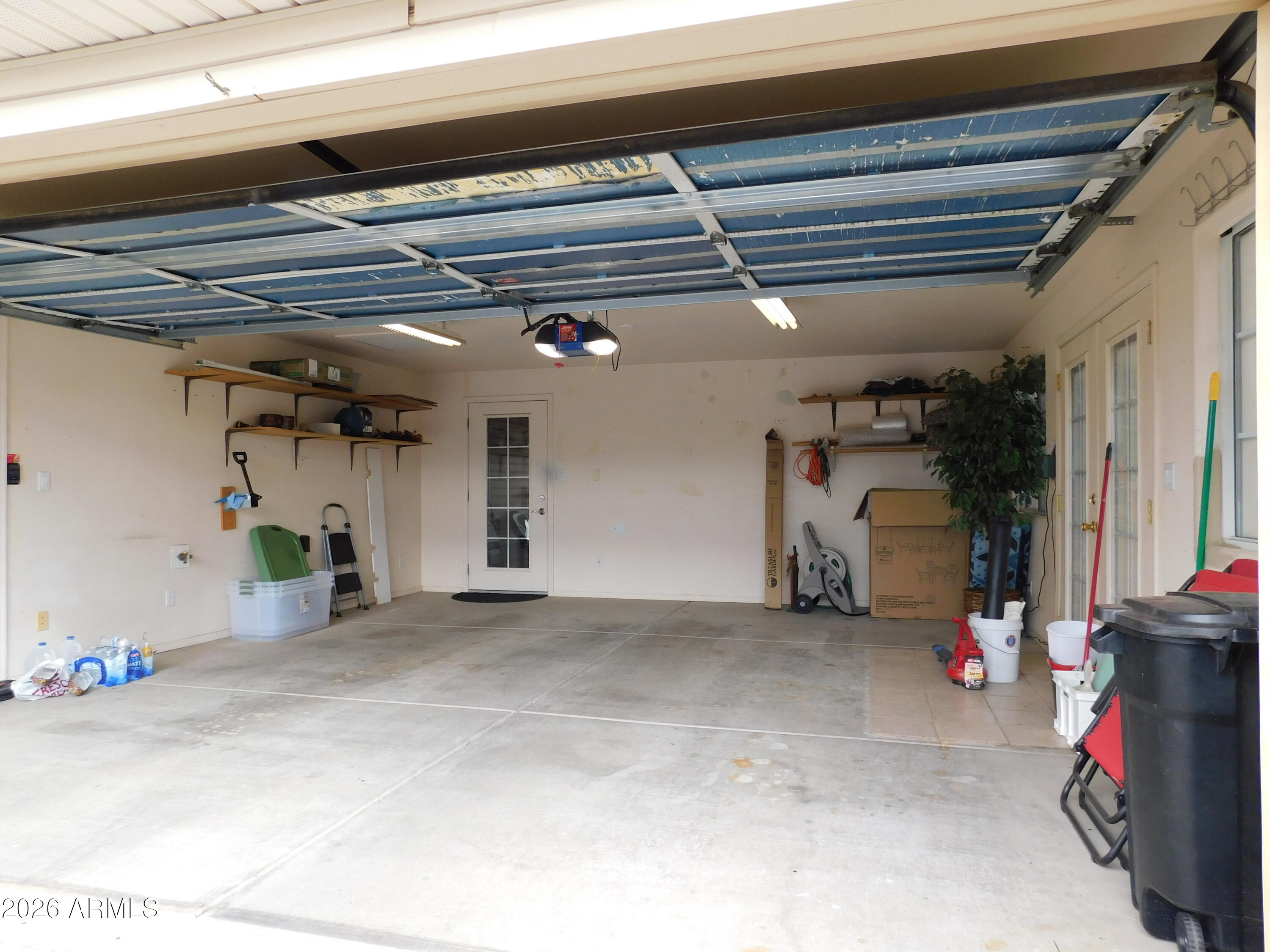 3301 South Goldfield Road, Unit 1054 Apache Junction, AZ 85119 - Photo 33 of 41 a view of a car garage