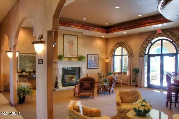 3301 South Goldfield Road, Unit 1054 Apache Junction, AZ 85119 - Photo 36 of 41 a living room with furniture fireplace and a large window