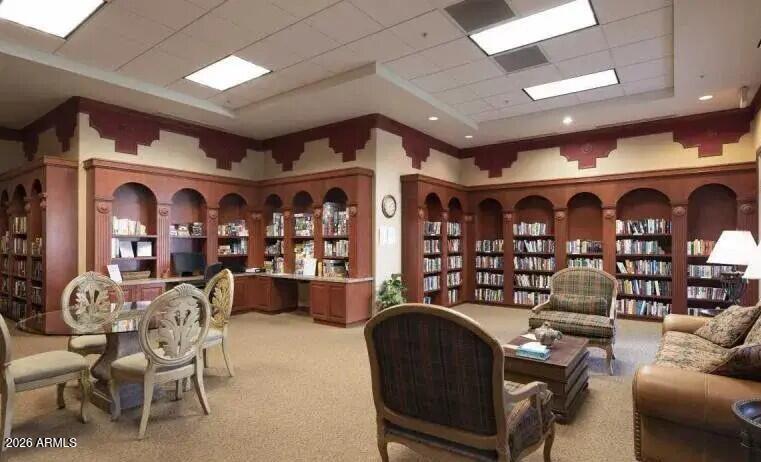 3301 South Goldfield Road, Unit 1054 Apache Junction, AZ 85119 - Photo 38 of 41 a living room with lots of furniture and a chandelier