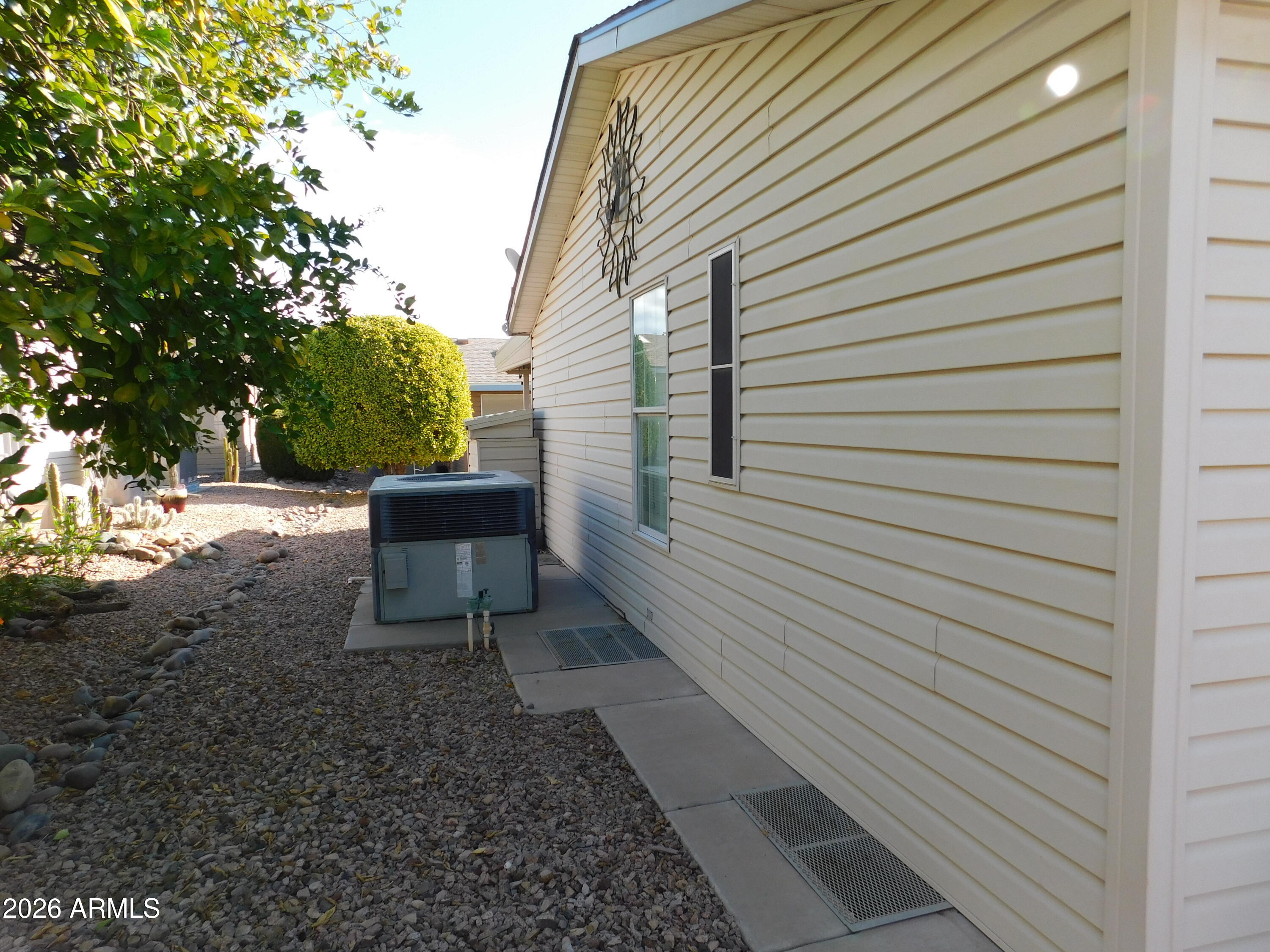 3301 South Goldfield Road, Unit 1054 Apache Junction, AZ 85119 - Photo 7 of 41 a view of a back yard of the house with a chair