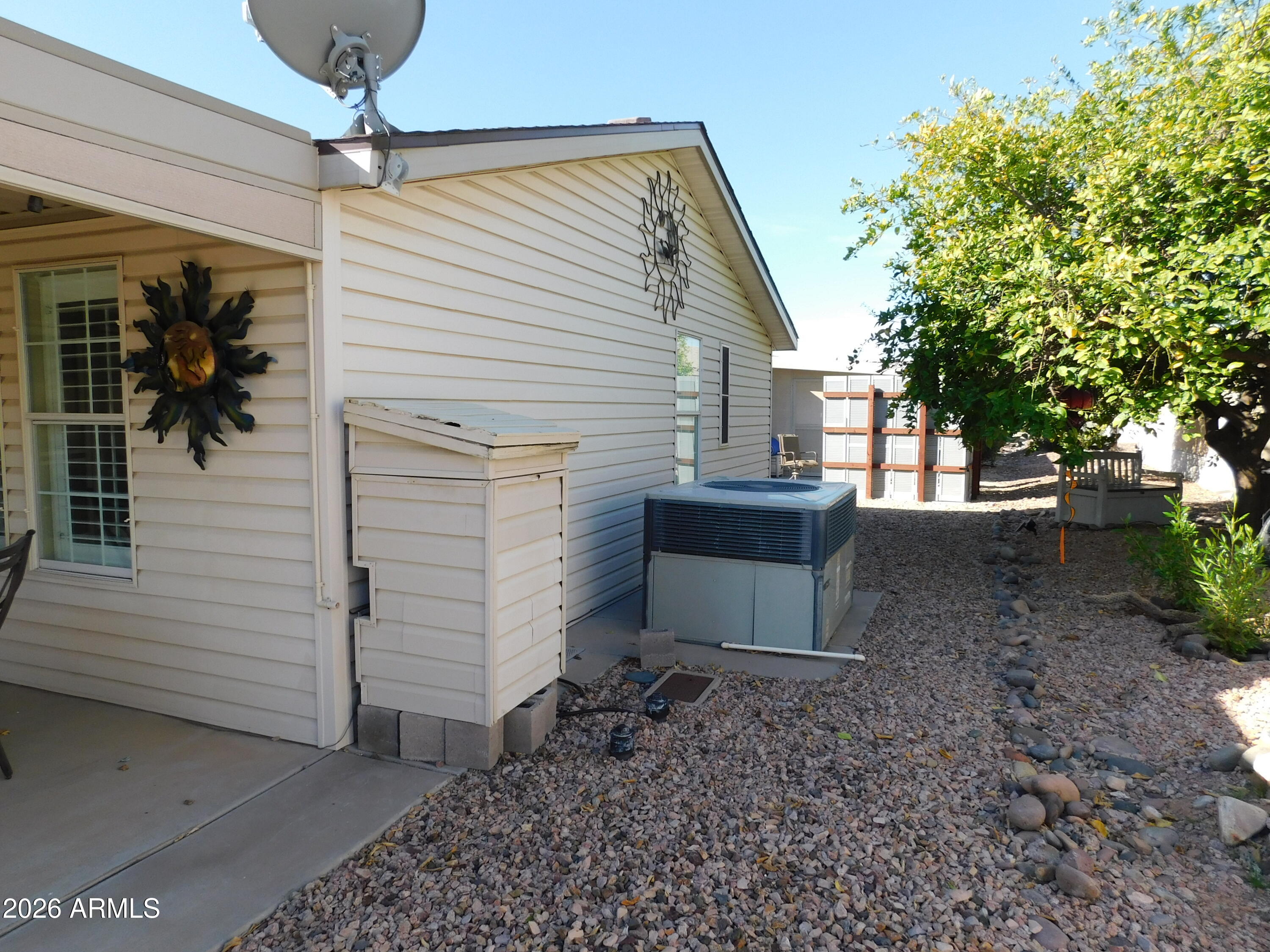 3301 South Goldfield Road, Unit 1054 Apache Junction, AZ 85119 - Photo 8 of 41 a view of a house with a yard