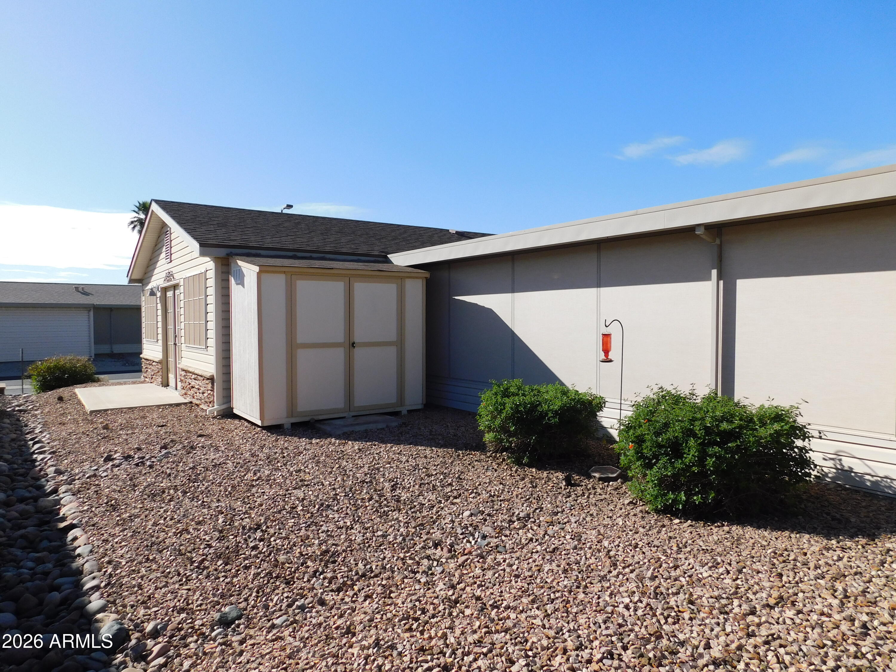 3301 South Goldfield Road, Unit 1054 Apache Junction, AZ 85119 - Photo 10 of 41 a house view with a backyard space