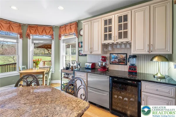 a kitchen with a stove a sink and a microwave