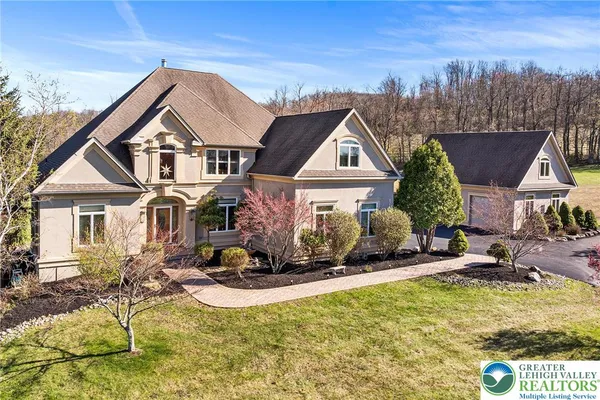 a front view of house with yard outdoor seating and barbeque oven