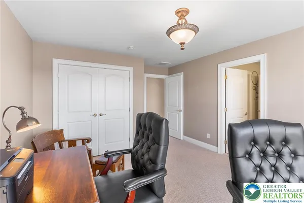 a view of a livingroom with furniture and windows