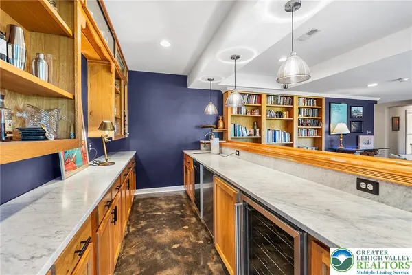 a kitchen with stainless steel appliances granite countertop a sink and stove