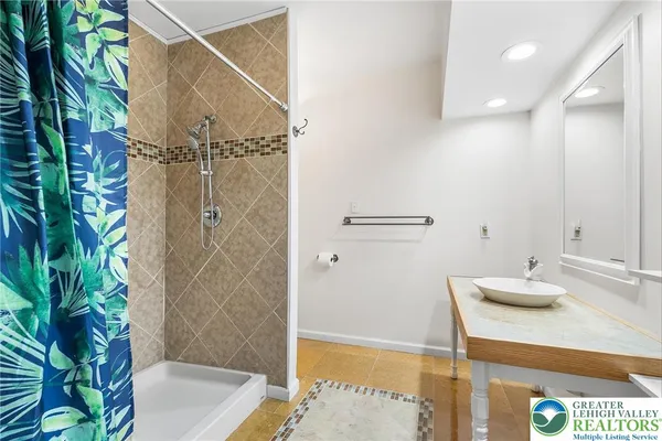 a bathroom with a sink and a shower