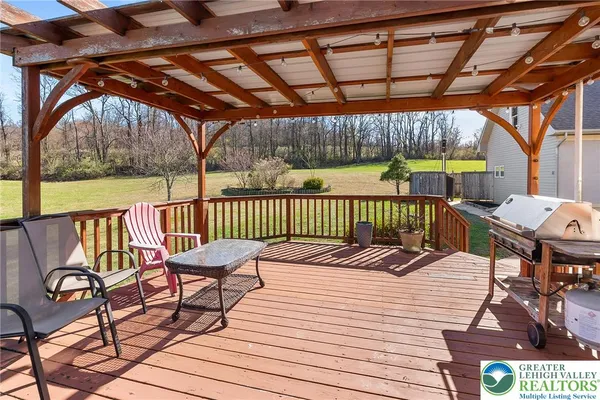 a view of a chairs and table on the deck