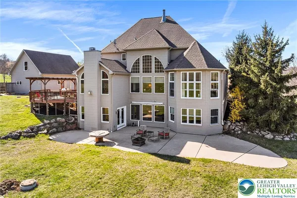 a view of a big house with swimming pool