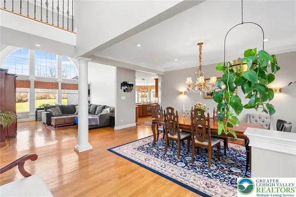 a living room filled with furniture hardwood floor and a table