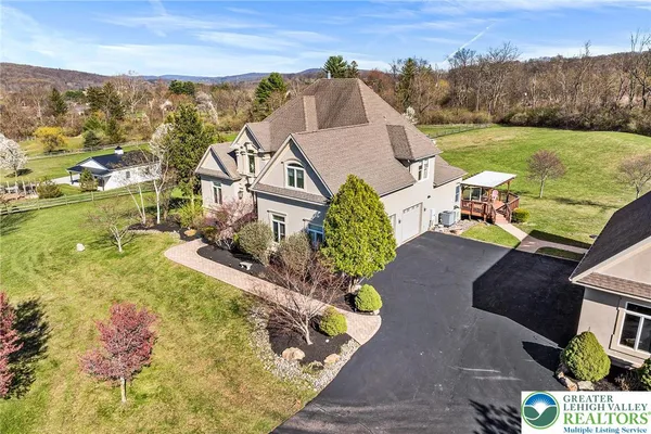 an aerial view of a house with a garden