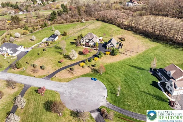 a view of a swimming pool with a yard