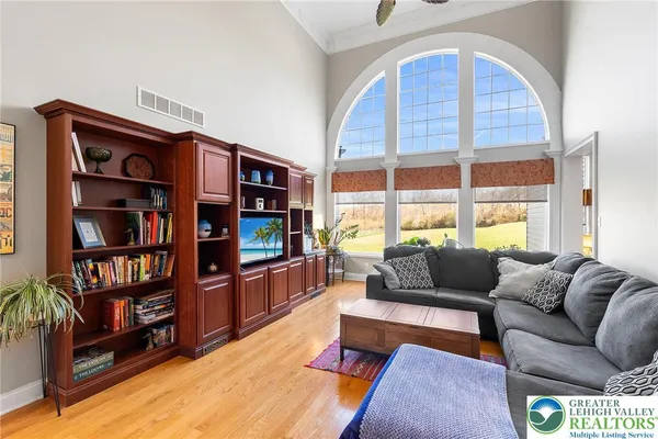 a living room with furniture cabinets and a book shelf